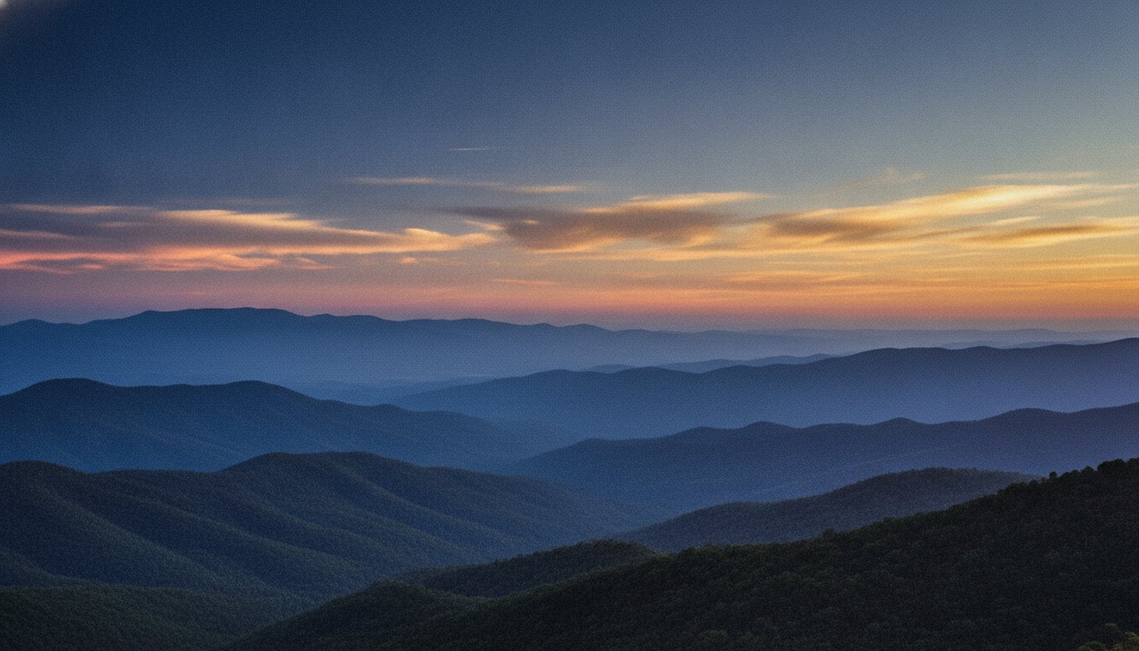 The Blue Ridge Mountains around Asheville at dawn, layered ridgelines in blue mist